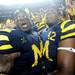 Michigan senior tight end Kevin Koger and senior linebacker J.B. Fitzgerald celebrate as Michigan beat Notre Dame 35-31 during the first-ever night game at Michigan Stadium on Saturday. Melanie Maxwell I AnnArbor.com